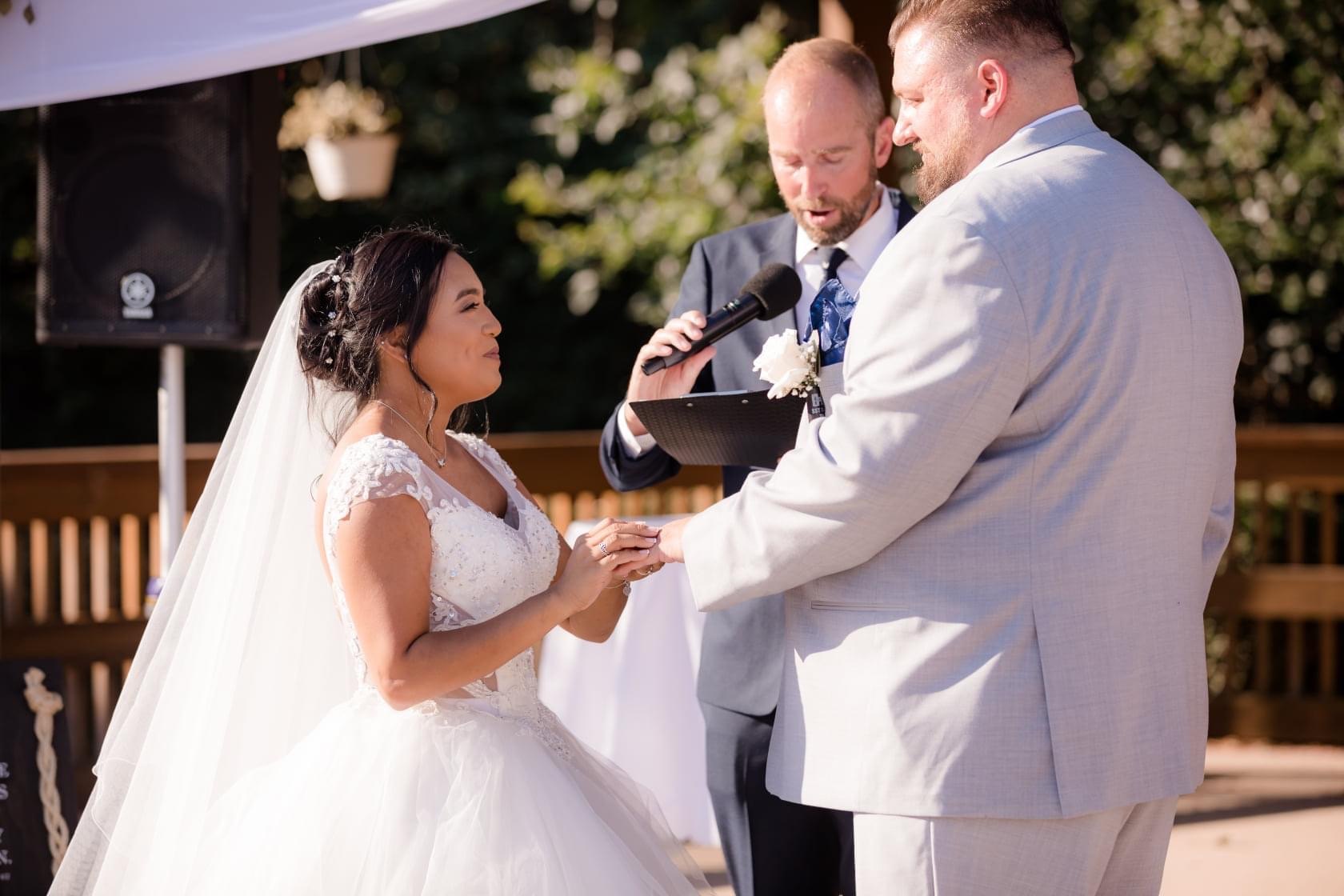 Bride and groom exchanging vows — One Idea Entertainment