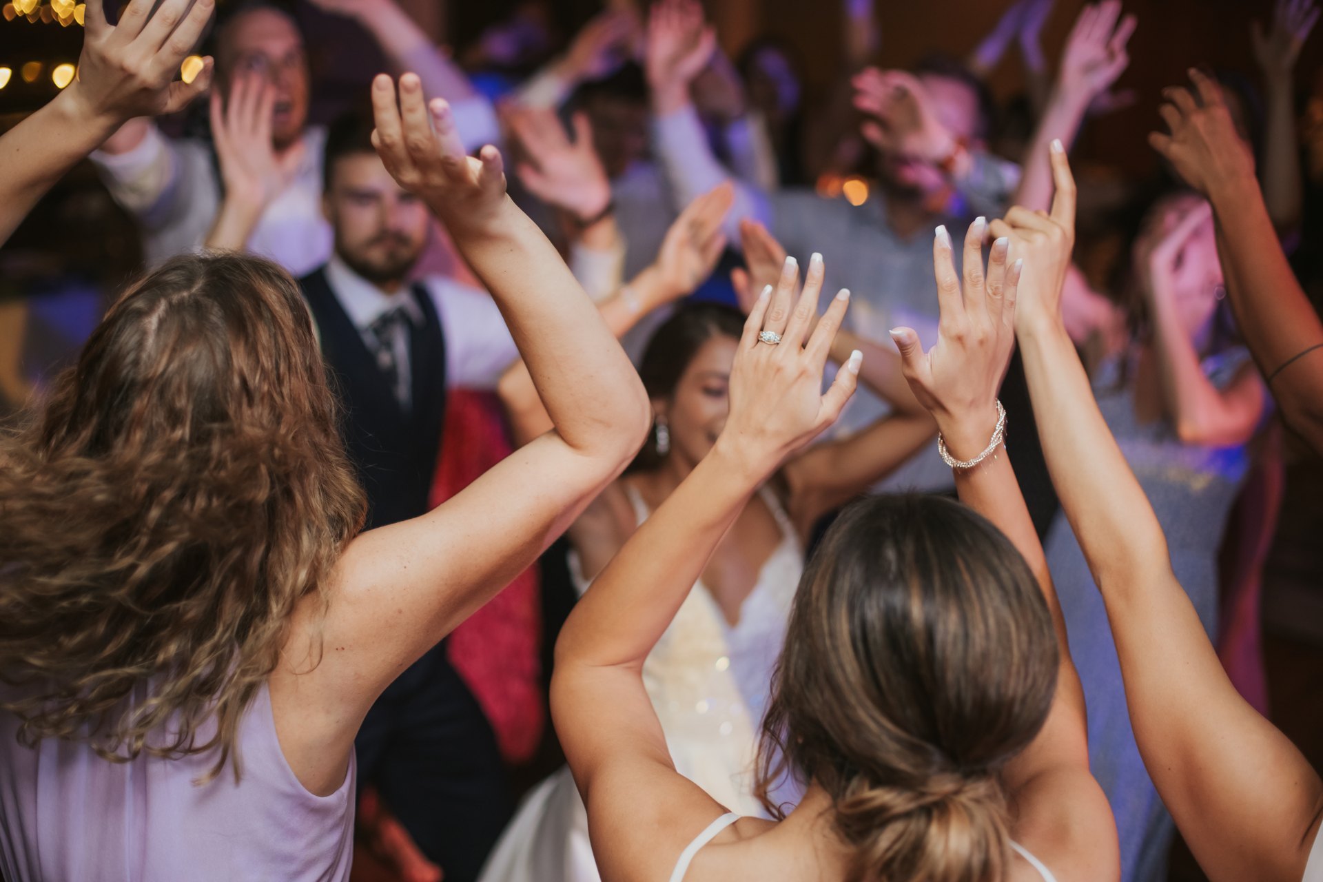 Guests dancing together at a wedding — One Idea Entertainment
