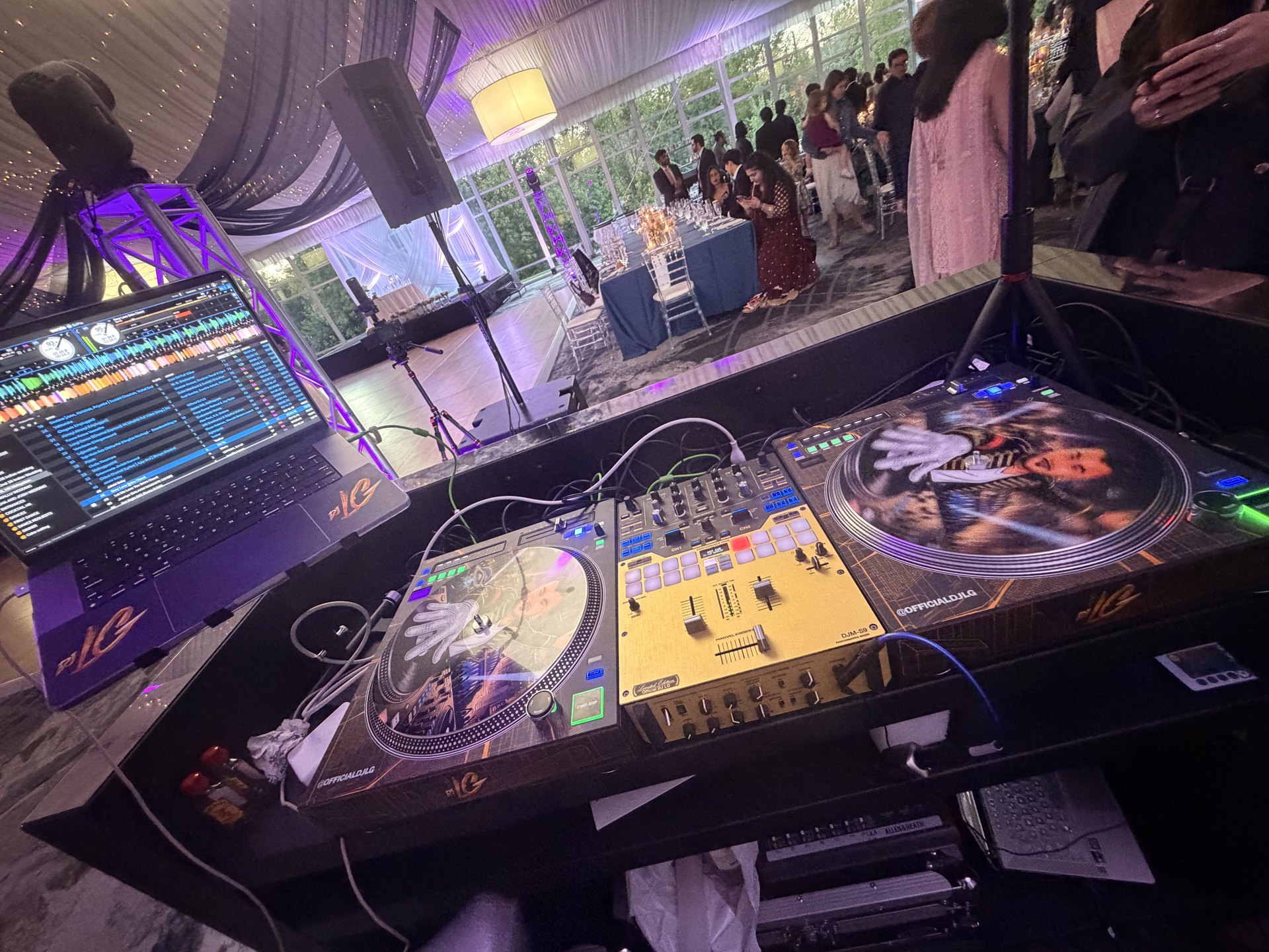 DJ mixing console at a live event — One Idea Entertainment